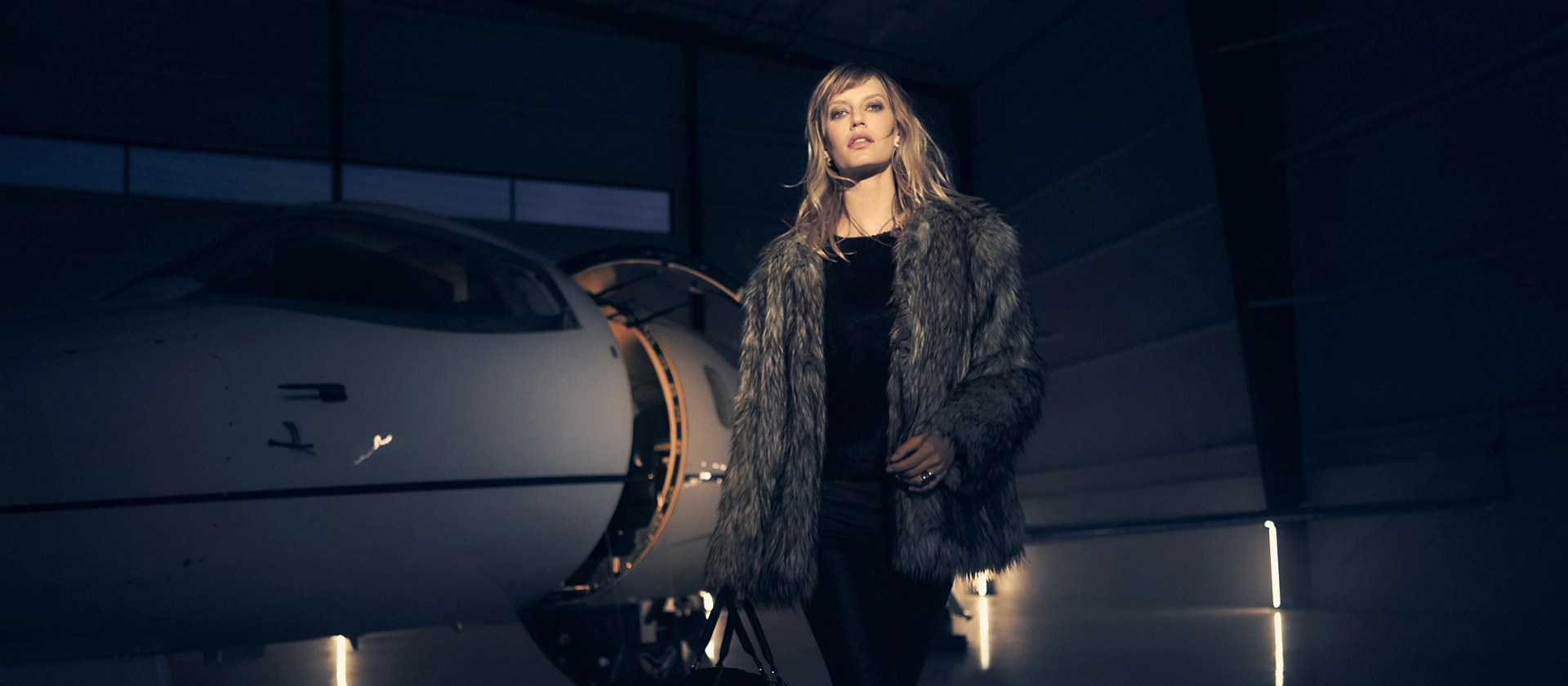 A woman is showing leaving a private jet to align with the exclusivity of 2025 Lincoln Black Label