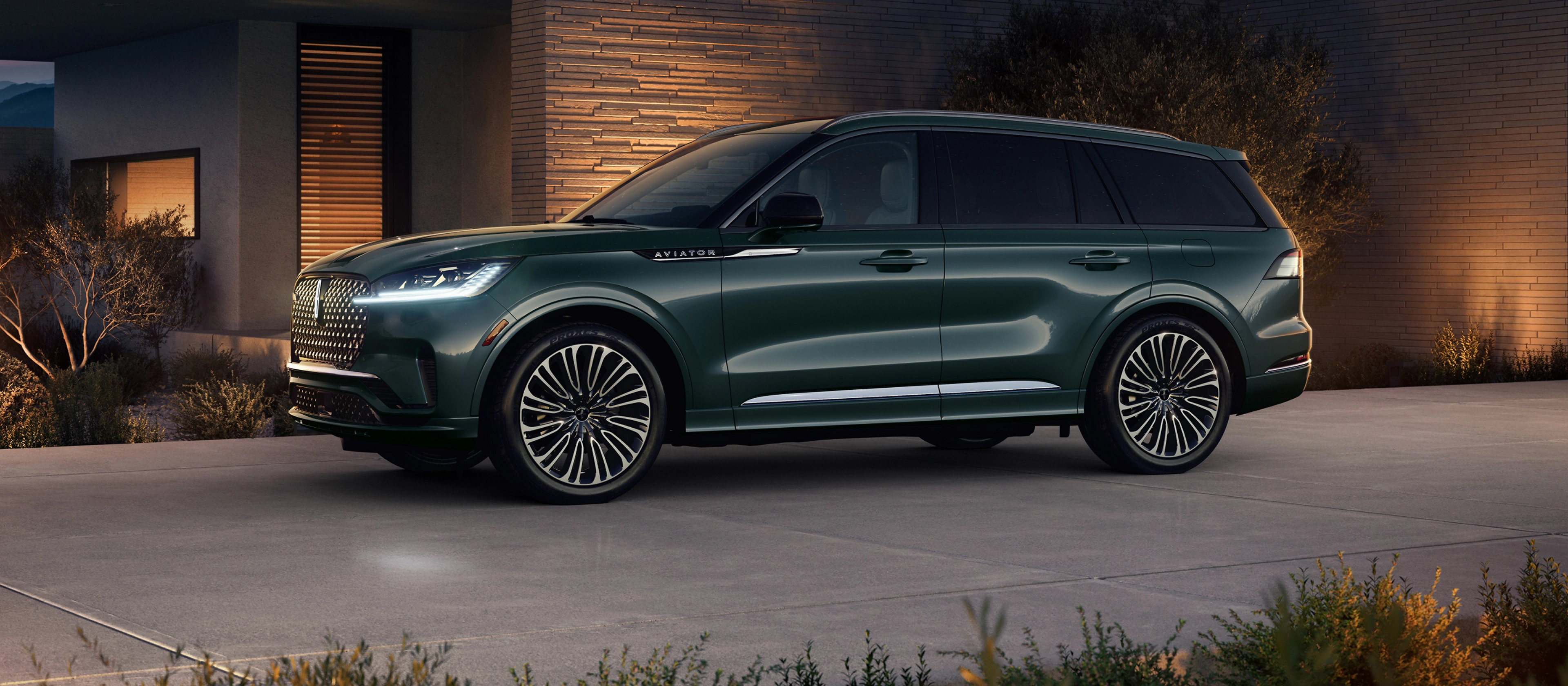 A 2025 Lincoln Black Label Aviator® SUV is parked in the driveway of modern home in the southwest