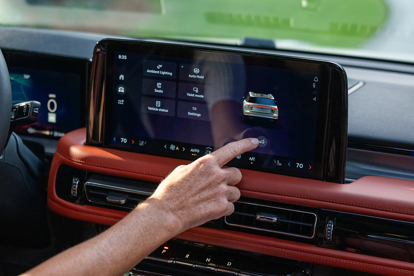 A man using the center touch screen.