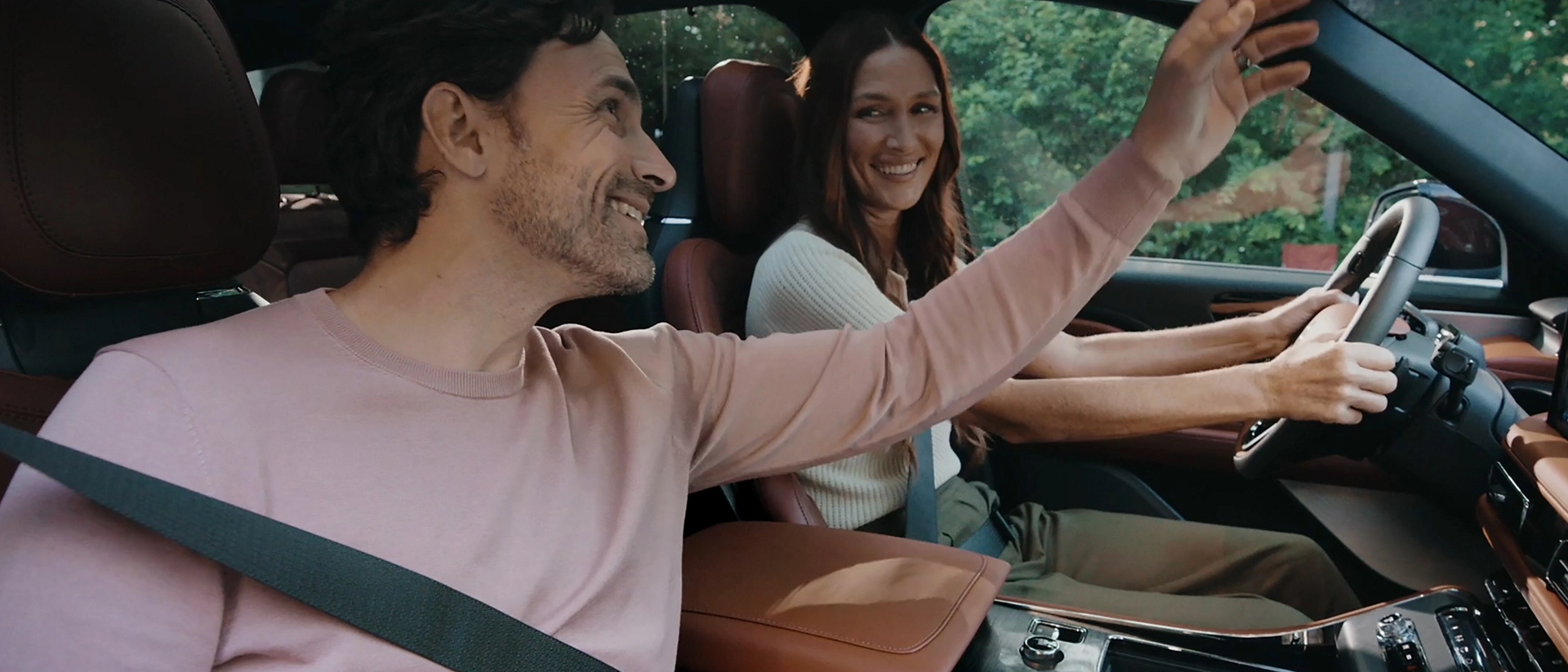 A couple sits in the front seats of a 2026 Lincoln Aviator® SUV