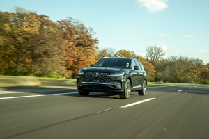 A Lincoln Black Label Aviator® SUV is parked in a private airplane hangar.