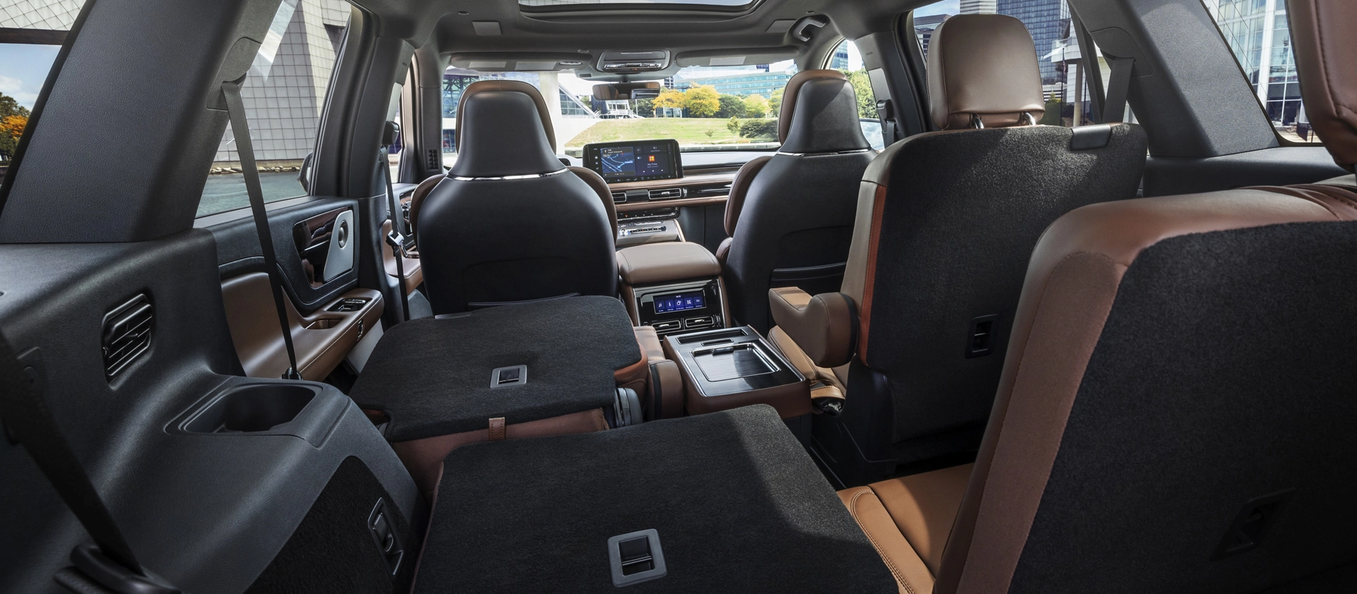 One side of the PowerFold® third-row seat and a second-row seat are folded forward in the 2026 Lincoln Aviator® SUV