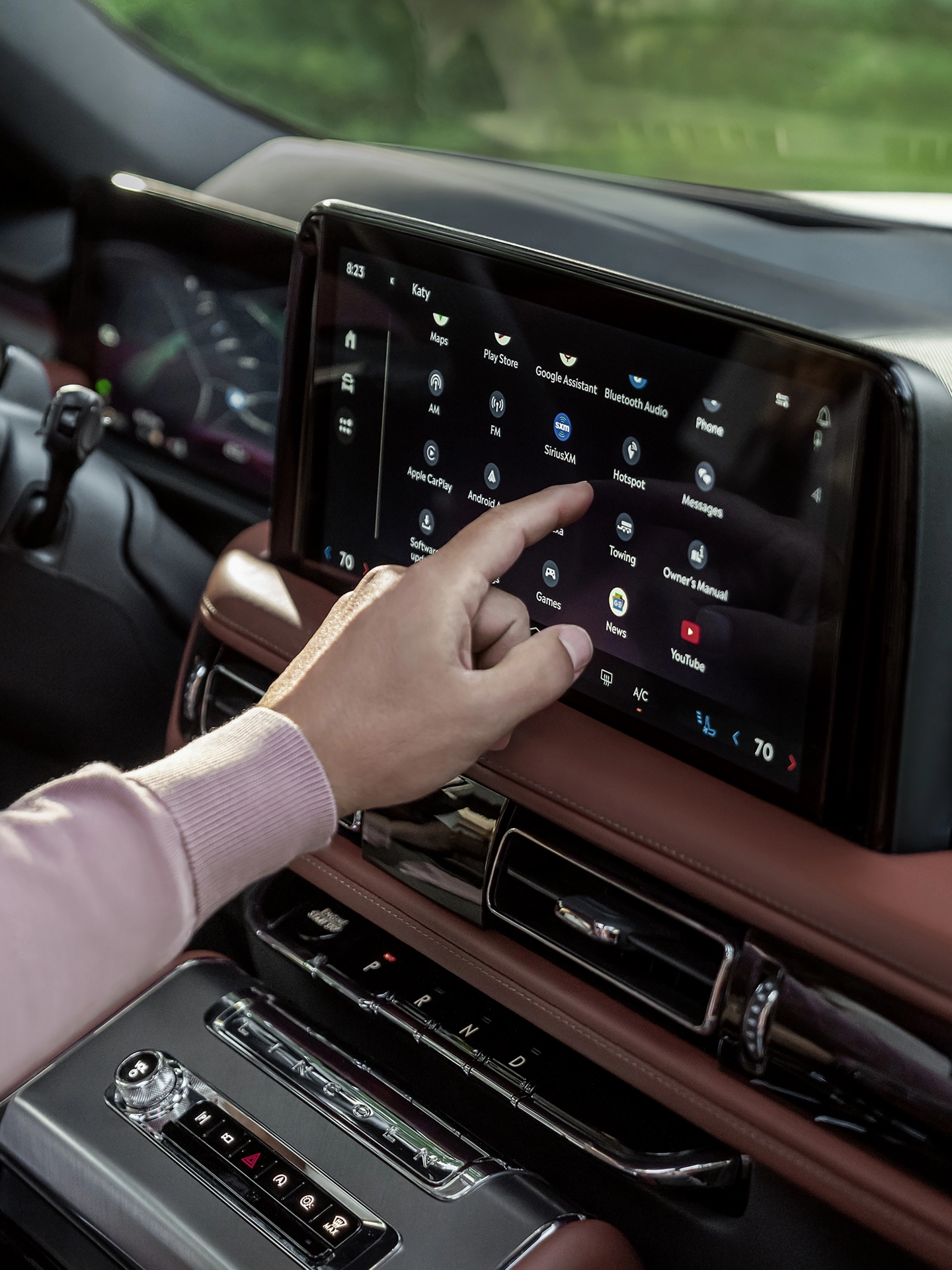 A man using the center touchscreen on his Lincoln Aviator