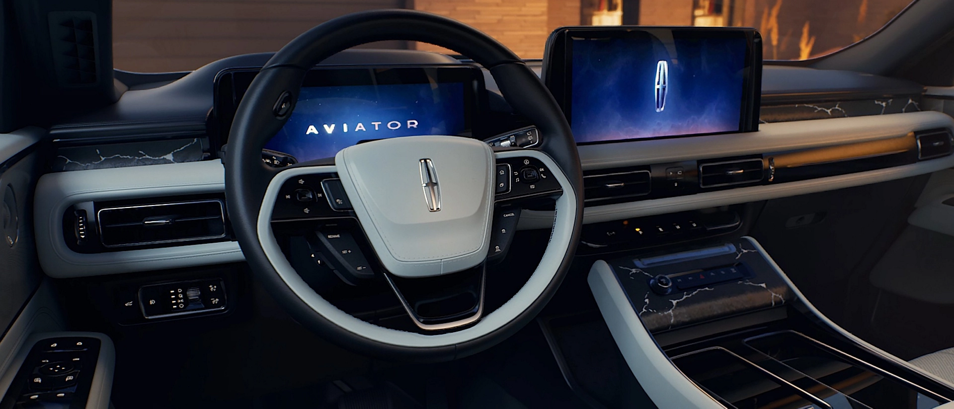 A couple sits in the front seats of a 2026 Lincoln Aviator® SUV.