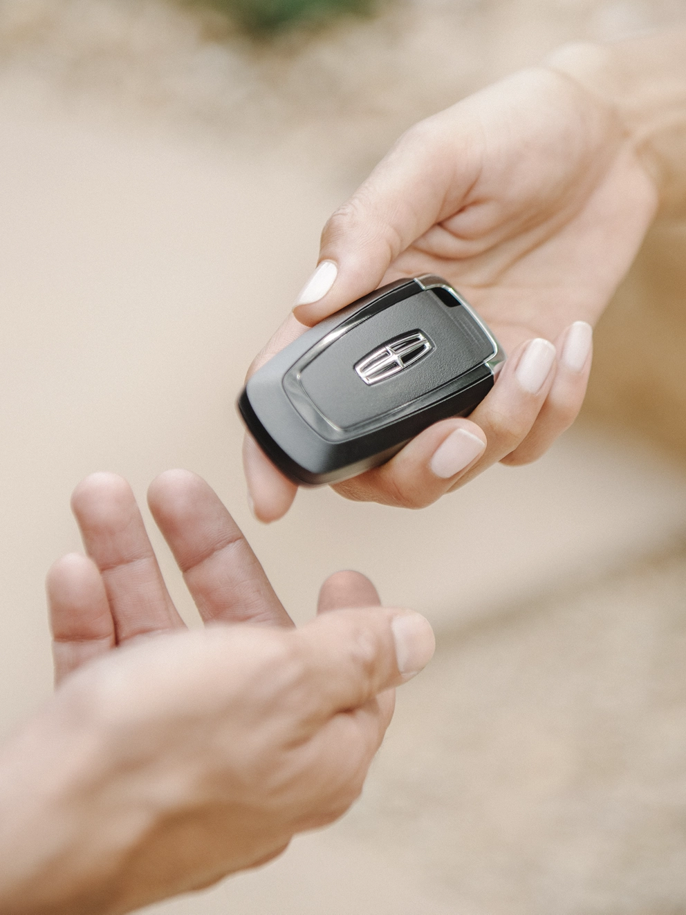 The Key fob for a Lincoln vehicle.