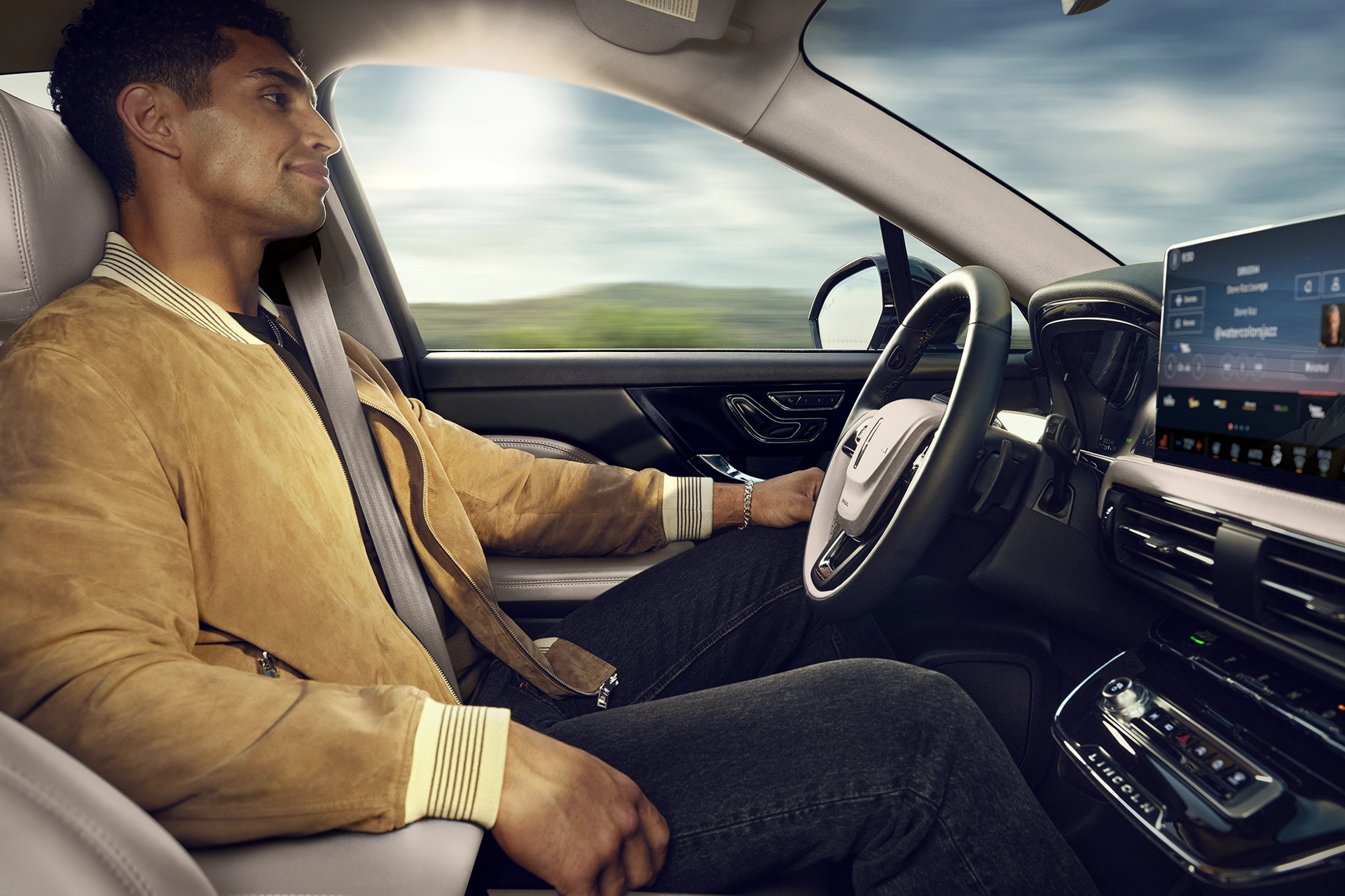 A man sitting in the driver seat of a 2025 Lincoln Corsair.