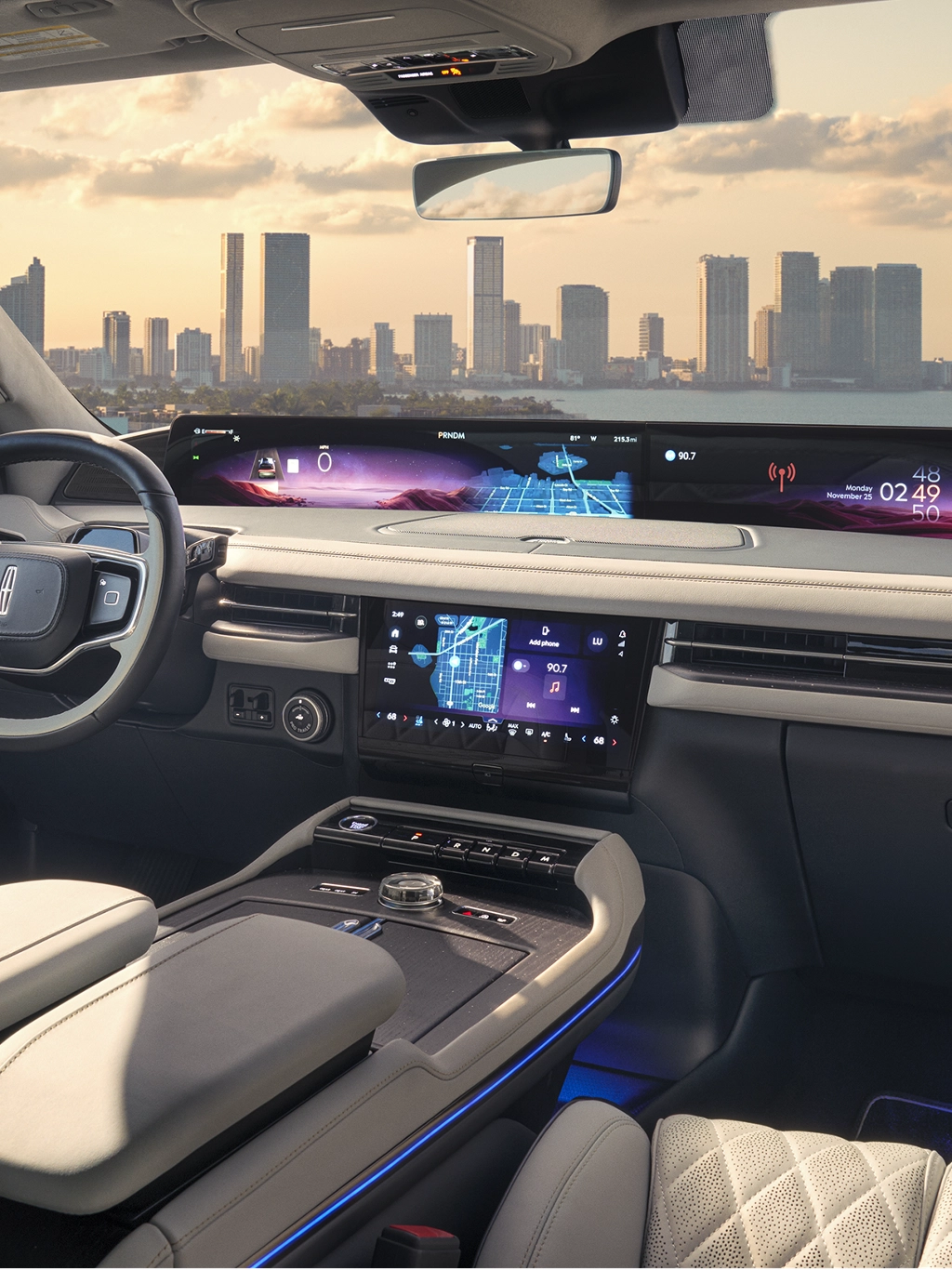 A man using the center touchscreen on his Lincoln Aviator.